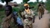 Seleka fighters patrol as they search for Anti-Balaka Christian militia members in the town of Lioto June 6, 2014. 