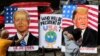 Guru seni India, Sagar Kambli, melukis Presiden Donald Trump dan pesaingnya Joe Biden di trotoar di luar sekolah seninya yang masih ditutup karena pandemi COVID-19 di Mumbai, India, Kamis, 29 Oktober 2020. (AP Photo / Rajanish Kakade)