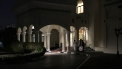 Members of a Taliban negotiating team enter the venue hosting U.S.-Taliban talks in the Qatari capital Doha, Aug. 29, 2019.