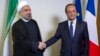 ضیافت ناهار روحانی و اولاند با اعتراض ایران به پذیرایی با شراب، لغو شد