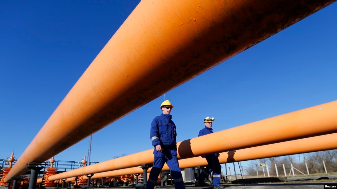 FILE - Engineers oversee the gas distribution system in Kiskundorozsma, 170 kilometers south of Budapest, through which Hungary's FGSZ Gas distribution company routes Russian gas toward Serbia, Jan. 15, 2015.