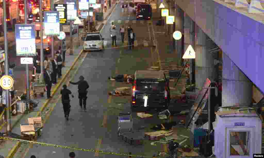 Bodies are seen outside Turkey's largest airport, Istanbul Ataturk, Turkey, following a blast, June 28, 2016.