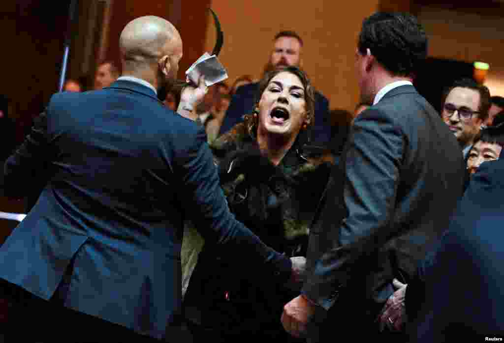 Australian Senator Lidia Thorpe stages a protest as Britain's King Charles and Queen Camilla attend a Parliamentary reception in Canberra.