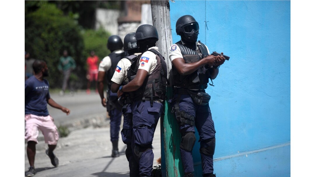 Police officers patrol in search for suspects in the murder Haiti's President Jovenel Moise, in Port-au-Prince, Haiti, July 8, 2021.
