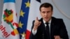 FILE - French President Emmanuel Macron gestures as he delivers a speech after a meeting via video-conference with leaders of West African G-5 Sahel nations, in Paris, France, Feb. 16, 2021. 