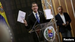 Venezuelan opposition leader Juan Guaido speaks during a meeting with technicians and experts in Caracas, May 16, 2019. 