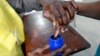 FILE - A voter's finger is marked after voting in the general election in Maputo, October 2014.