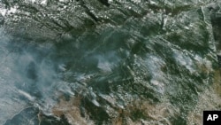 FILE - This satellite image provided by NASA on Aug. 13, 2019, shows several fires burning in the Brazilian Amazon forest.