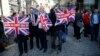 Vote Leave supporters wave Union flags, following the result of the EU referendum, outside Downing Street in London, Britain June 24, 2016. 