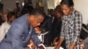 Congolese President Denis Sassou Nguessou arrives to cast his ballot in Brazzaville, Oct. 25, 2015.