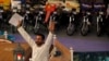 Aamir Liaquat Hussain, host of the Geo TV channel program "Amaan Ramazan", gestures while asking participants questions during a live show in Karachi, July 26, 2013. 