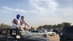 Supporters of opposition candidate Mohamed Ould Mouloud sit on their car for a better view of his final campaign rally. (Photo: E. Sarai)
