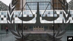 FILE - A person leaves the International Criminal Court in The Hague, Netherlands, Jan. 16, 2019.