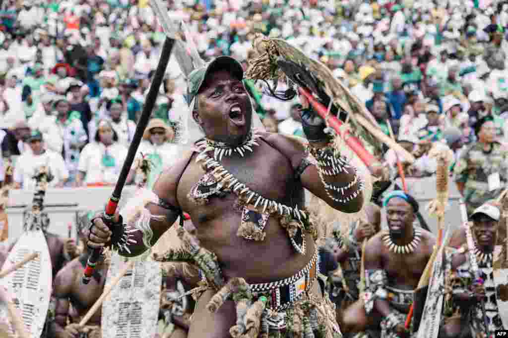 An Amabutho (Zulu regiment) gestures at Umkhonto We Sizwe (MKP) party supporters gathering during the party's first anniversary celebrations at the Moses Mabhida stadium in Durban, South Africa.