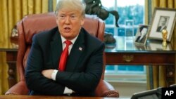 FILE - President Donald Trump speaks during a meeting in the Oval Office of the White House in Washington, Oct. 10, 2018.
