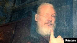 WikiLeaks founder Julian Assange arrives at the Westminster Magistrates Court, after he was arrested in London, Britain April 11, 2019. 