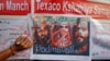 A man signs a banner during a signature campaign as part of a protest against the release of Bollywood movie "Padmavati" in Kolkata, India, Nov. 22, 2017.