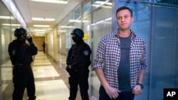FILE - Russian opposition leader Alexey Navalny speaks to the media in Moscow, Russia, Dec. 26, 2019. The sudden death of Navalny, the fiercest foe of Russia's President Vladimir Putin, has left Russian opposition with an open wound. 