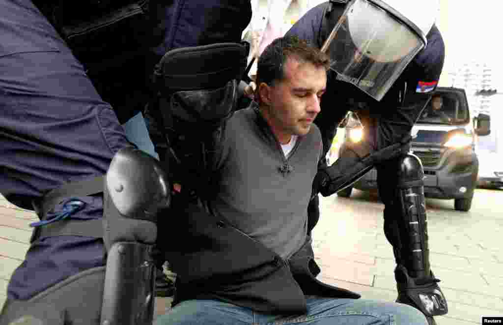 Savo Manojlovic, leader of Move Change party, is detained by Serbian police during a protest over the authorities' plan to begin demolition and removal of the Old Sava Bridge, in Belgrade, Serbia.