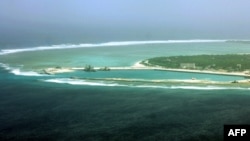 FILE - This file aerial view taken on July 27, 2012 shows part of the city of Sansha on the island of Yongxing, also known as Woody island in the disputed Paracel chain, which China now considers part of Hainan province. 