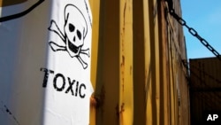 Containers marked as "Toxic" carrying Syria's chemical weapons materials are seen on board a Danish ship transporting the cargo out of the strife-torn country as part of an international initiative, in Cyprus coastal waters, May 13, 2014.
