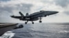FILE - A U.S. Navy F/A-18E Super Hornet launches from the flight deck of the aircraft carrier USS Dwight D. Eisenhower in the Mediterranean Sea, June 28, 2016.