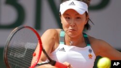 FILE - China's Shuai Peng plays a shot against Romania's Sorana Cirstea during their first round match of the French Open tennis tournament at the Roland Garros stadium, in Paris, France, May 30, 2017.