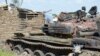 FILE - Tanks destroyed during fighting between forces of Salva Kiir and Riek Machar, on July 10, 2016 in Jabel area of Juba, South Sudan.