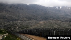 ences are seen on the ceasefire line between Israel and Syria in the Israeli-occupied Golan Heights, Oct. 28, 2020.