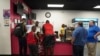 Romane Pierre of Rose Goute Creole Restaurant in Springfield, Ohio, helps a line of customers, Sept. 16, 2024. 