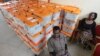 FILE - Polling station workers are seen guarding ballot boxes following presidential elections in Lusaka, Zambia, Jan. 21, 2015.