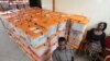 FILE - Polling station workers are seen guarding ballot boxes following presidential elections in Lusaka, Zambia, Jan. 21, 2015.
