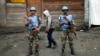 FILE - Two MONUSCO UN soldiers stand guard in Goma's port, eastern Congo.