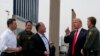 FILE - President Donald Trump reviews border wall prototypes, March 13, 2018, in San Diego.