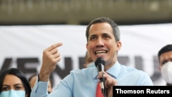 FILE PHOTO: Opposition leader Juan Guaido speaks to the media during a news conference the day after the parliamentary election in Caracas.