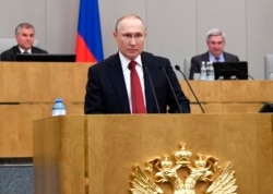 FILE - Russian President Vladimir Putin speaks during a session of the State Duma, the Lower House of the Russian Parliament, prior to its members voting on constitutional amendments, in Moscow, March 10, 2020.