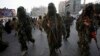 Masked Palestinian members of the Ezz Al-Din Al Qassam brigade, the military wing of Hamas in Gaza City, Nov. 14, 2013.