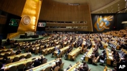 People gather at the U.N. General Assembly, prior to a vote, Dec. 21, 2017, at United Nations headquarters in New York. 