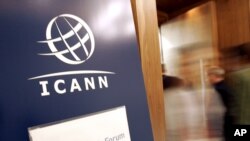 FILE - People enter ICANN's public forum in Lisbon, Portugal in this 2007 photo.
