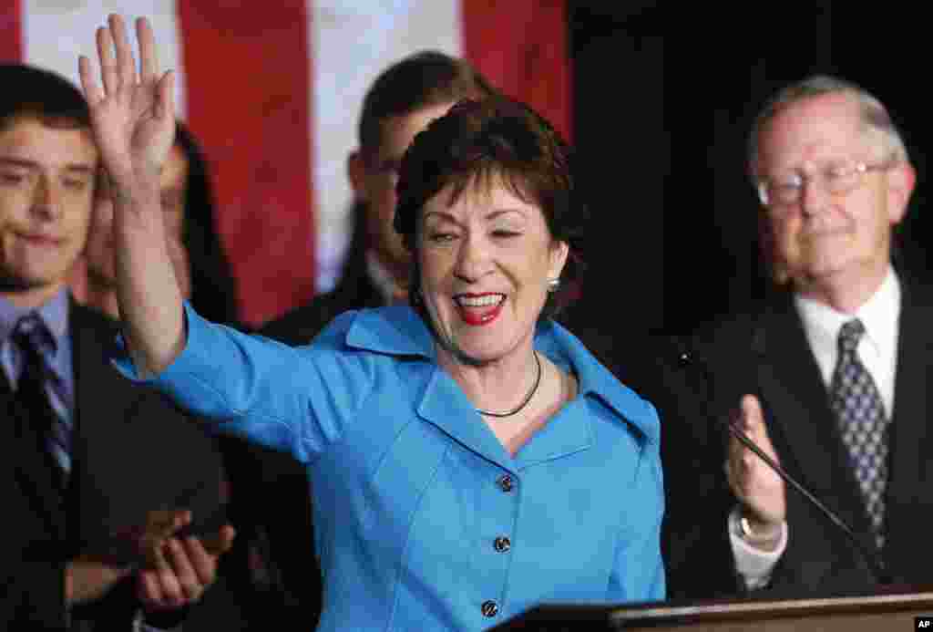 In Maine, Republican incumbent Susan Collins celebrates her reelection victory with husband Thomas Daffron, right, in Portland, Nov. 4, 2014. 