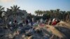 Warga Palestina melihat lokasi yang hancur akibat serangan udara Israel di kamp penampungan yang penuh sesak oleh warga Palestina yang mengungsi akibat perang di Muwasi, Jalur Gaza, Selasa, 10 September 2024. (Abdel Kareem Hana/AP)