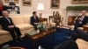 US President Joe Biden (R) and Vice President Kamala Harris (3rd L) meet with House Speaker Mike Johnson (2nd L) and Senate Minority Leader Mitch McConnell (L) in the Oval Office of the White House in Washington, DC on February 27, 2024.
