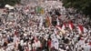 FILE - Muslim protesters march during a demonstration in Jakarta, Indonesia, Nov. 4, 2016. 