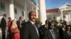 FILE - Abdel Fattah al-Burhan, then president of Sudan's Transitional Council, stands as he leaves after talks at the State House in Entebbe, Uganda, Nov. 7, 2019.