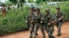 FILE - French troops arrive at a World Food Program food distribution point one kilometer from the airport.