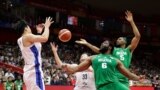 FILE - Nigeria's Ike Diogu competes in a FIBA World Cup, Sept. 4, 2019, against South Korea.