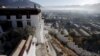 FILE - Morning mist covers downtown as seen from atop the Potala Palace in Lhasa, Tibet Autonomous Region, China.