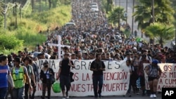 Migrants who had been waiting for temporary transit papers but failed to get them after waiting, some up to two months, leave Tapachula, Mexico,Oct. 30, 2023, as they make their way to the U.S. border.