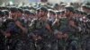 FILE - Members of Iran's Revolutionary Guards march during a military parade to commemorate the 1980-88 Iran-Iraq war in Tehran Sept. 22, 2007.