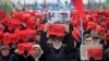 People hold posters reading "Who ordered the murder?" during a rally in memory of opposition leader Boris Nemtsov in St. Petersburg, Russia, Feb. 26, 2017.